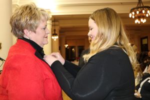 Dawn Welch being presented with her nursing pin
