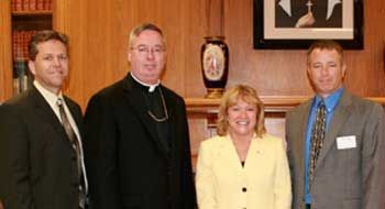 President King with representatives of Catholic Charities and the Archdiocese