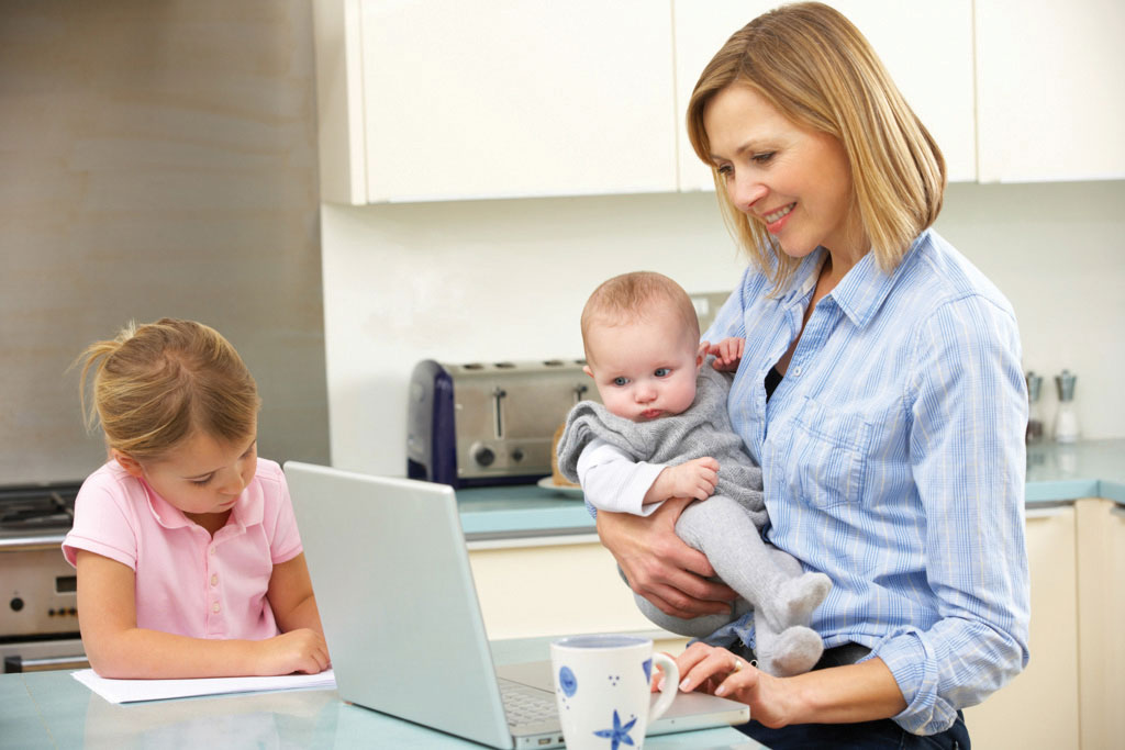 Mom with kids using computer