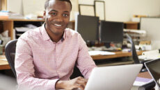 Guy on laptop in office