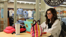 Student studying in front of the bookstore