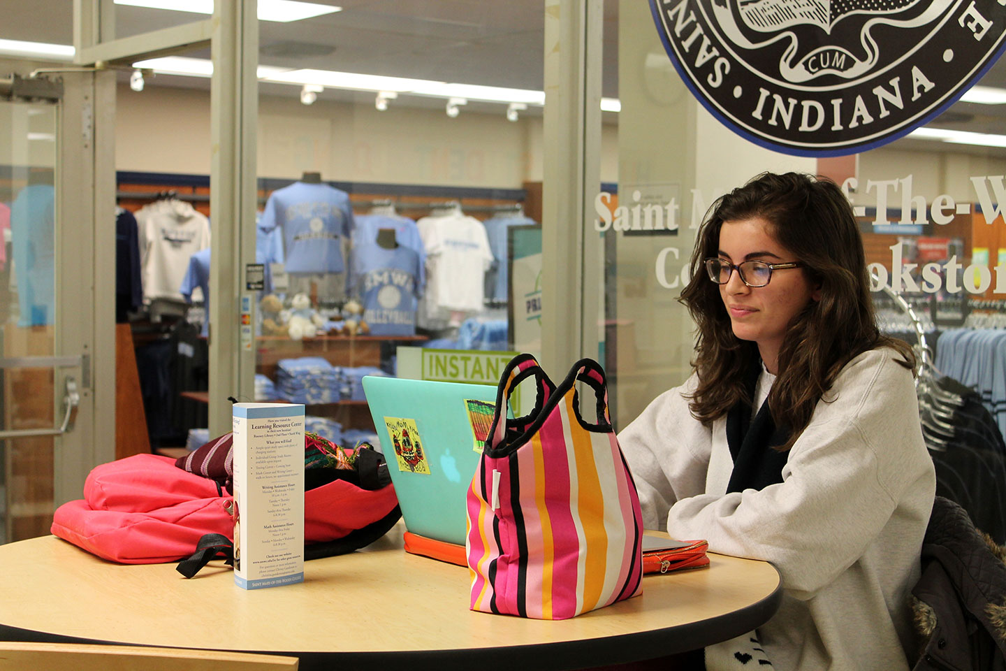 Student studying in front of the bookstore