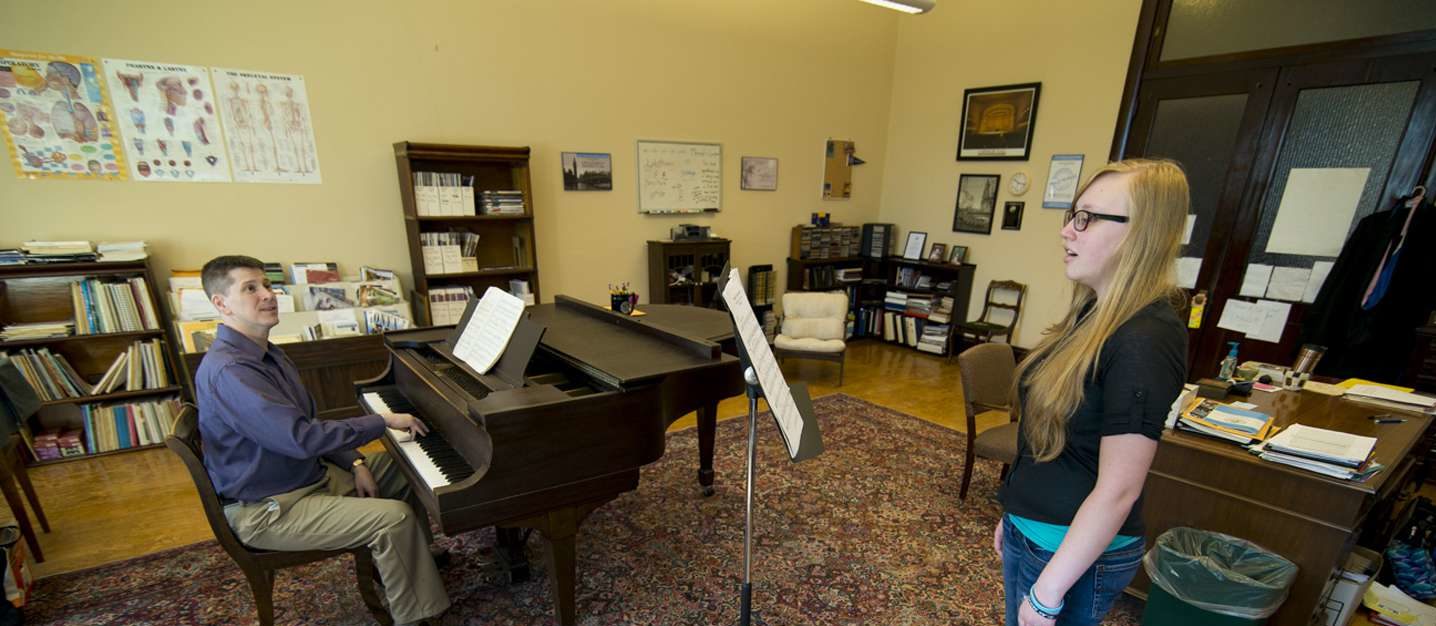 Professo and student singing lesson