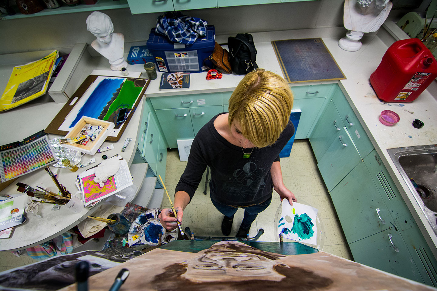 Student working on a painting