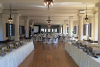 The ballroom set up for an event with buffet tables