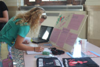 Student at the peace and justice club table