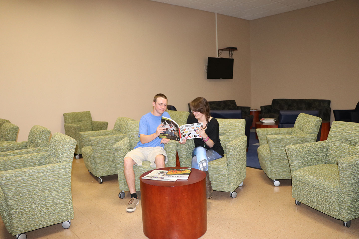 Students reading a book together