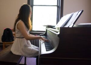 Student playing piano