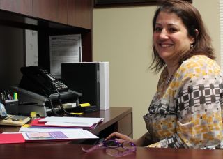 Katie at her desk