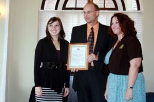 Nicole Wieg, junior; Ken Polky, executive director, Human Resources Center of Edgar and Clark County; and  Sharon Boyle, associate professor of music therapy.