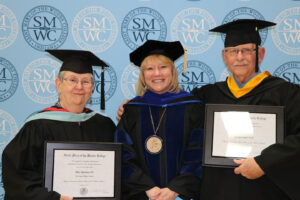 Alice Quinlan and Al Heramb standing with President King