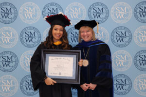 Katia Orozco standing with President Dottie L. King