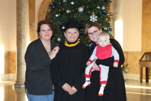 Terri May standing between her daughters