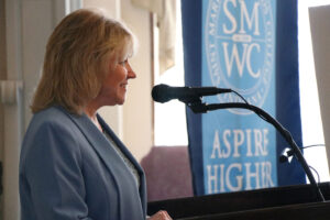 President Dottie L. King speaking at a lectern during the Aspire Higher campaign launch