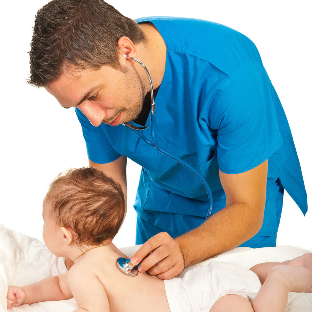 Male nurse examining baby on padded table