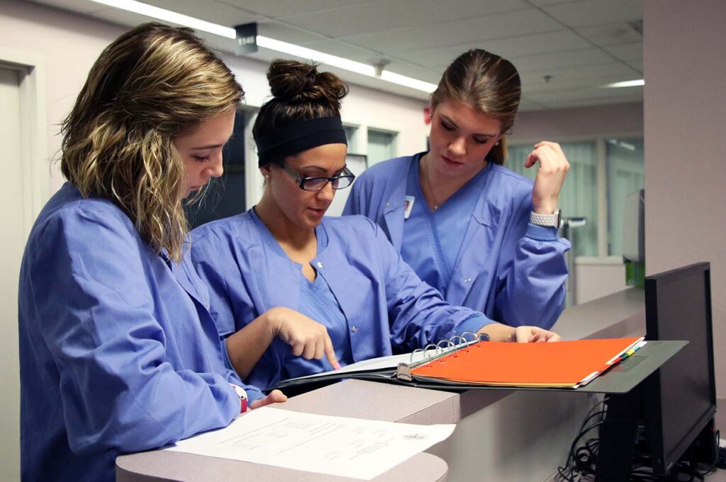 Group of nursing students looking at patient chats