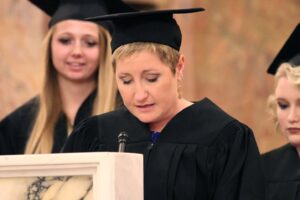 Nicole Shaughnessy speaking at a podium