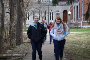 Students walking between stations on the walk