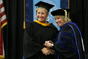 President King and Nicole Shaughnessy pose for photo holding award