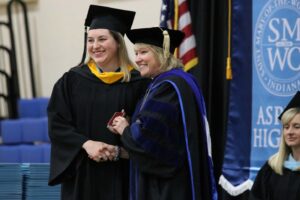 President King and Catherine Elizabeth Johnson pose for a photo holding up the award.