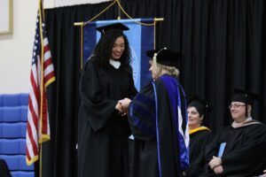 President King shaking the hand of Jordyn Lloyd