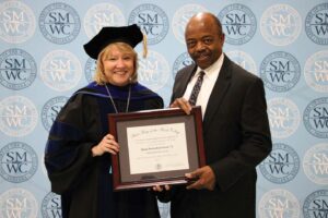 President King presenting award to Wayne Patrick at the May 2017 Commencement.