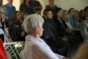 Judy Anderson sits watching the lake rededcation