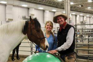 Tichenor and Peters stand with a horse at the Hoosier Horse Fair.