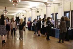 Student talk with faculty and staff at booths during the Great Start Boot Camp.