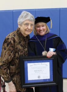 President King standing with Jerse holding the award at the 2018 spring commencement.