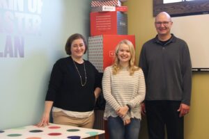 Moat standing with Jen and Jeff Perry at the BoxUp office.