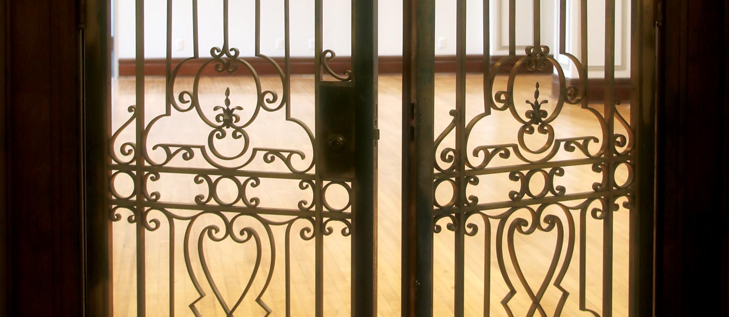 Close-up of the metal doors of Sullivan Parlor, with the renovated space visible behind.