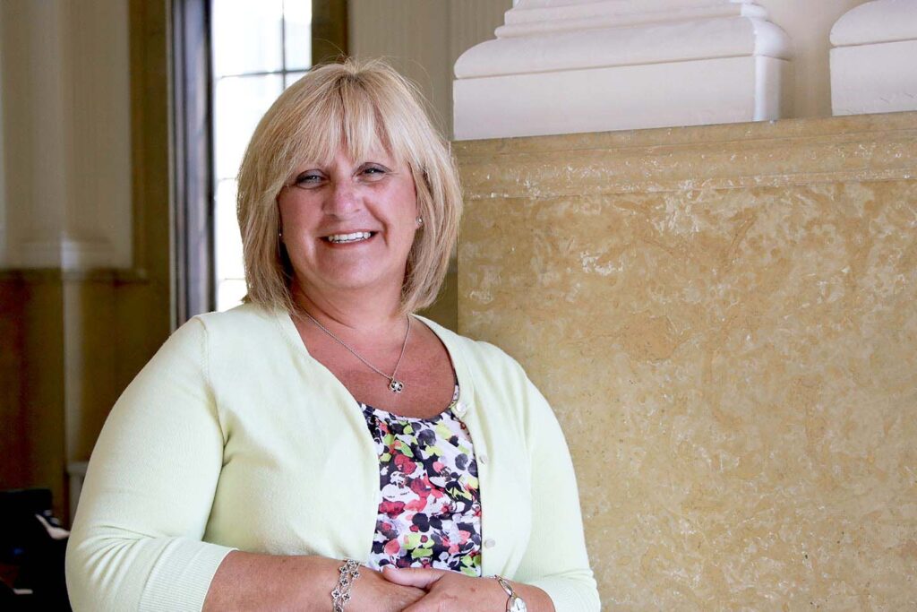 Amy Bridwell standing in the entrance of Le Fer Hall