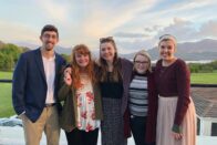 Thralls, Sonderman, Burns, Langenberger, and Payonk stand in front of scenic view of Muckross National Park