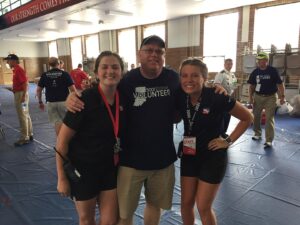 Mace and Miller pose for a photo with the Volunteer of the Year at the IPL 500 Festival Parade