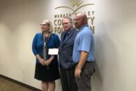 Dyer and Wood pose for a photo with a partner from the Wabash Valley Community Foundation