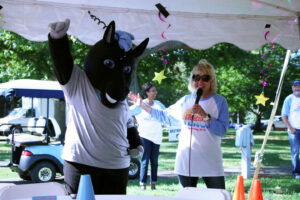 Onyx the horse gives a thumbs up as President King introduces her as the new mascot.