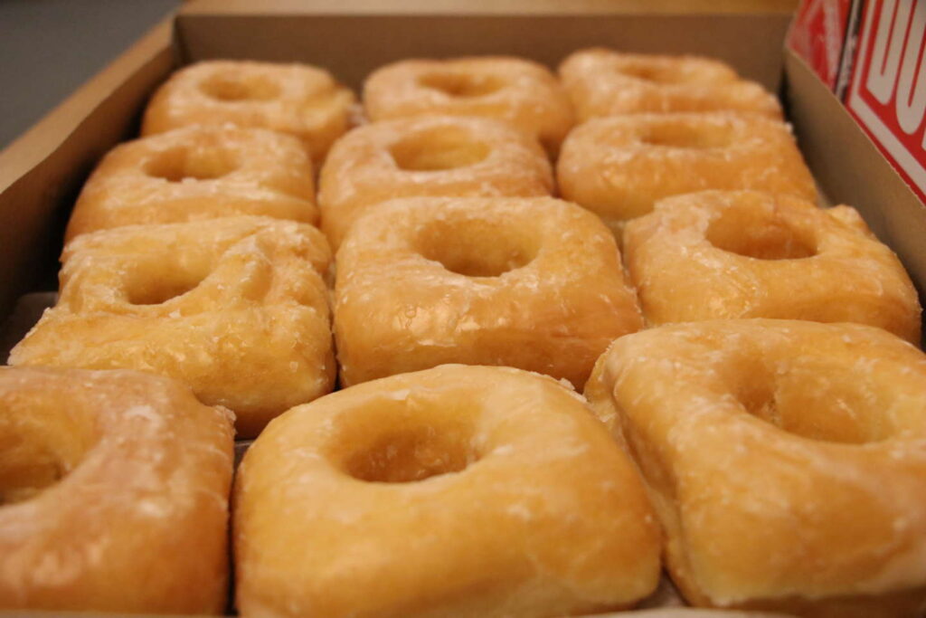 Closeup of a dozen square donuts
