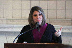 Rachel Leslie speaking at the event in Sullivan Parlor