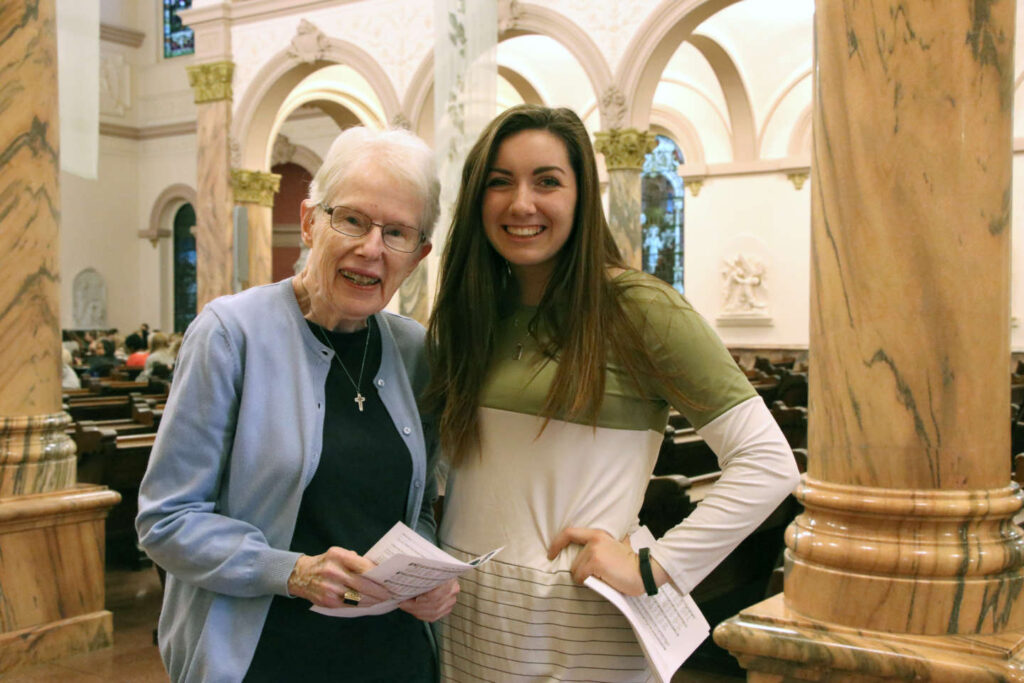 SMWC student Emma Taylor stands with Sister Ellen Cunningham in the Big Church