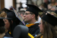 Student looks intently forward during the Spring 2018 commencement ceremony.