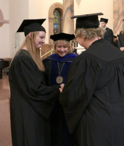 Mother Michelle presents Daughter Ashley with her Woods Ring after receiving her own.