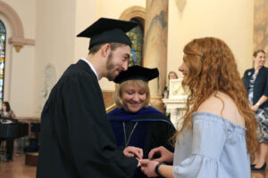 Shannon presenting Logan with his Woods Ring.