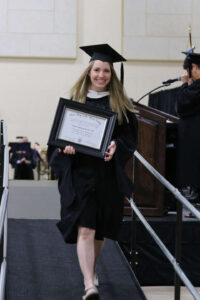 Nothdurft-Moeller walking down from the podium with her award