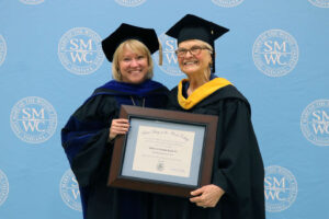 Kuck and President King holding the award