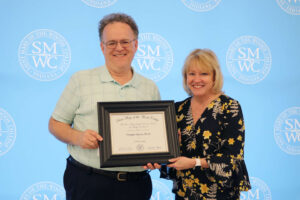 Douglas Sperry holding award with President King