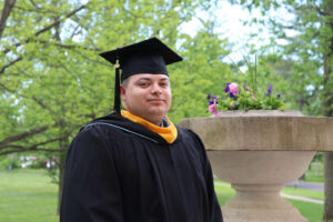 Ashley standing in front of Guerin Hall