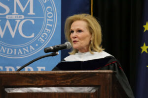 Lubbers speaking at the commencement podium