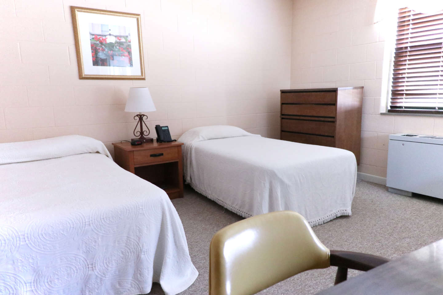 Guest House room with desk and chair accommodations