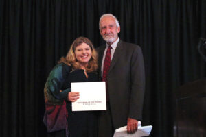 Larson with Paul Hollenbeck at the scholarship ceremony